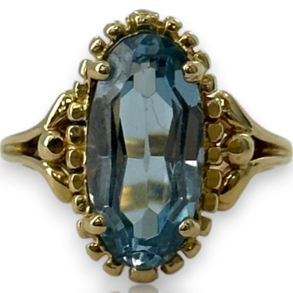 1970-80s Victorian Revival Era Solid 14kt Yellow Gold and Lab Created Blue Spinel Long Oval Solitaire Ring